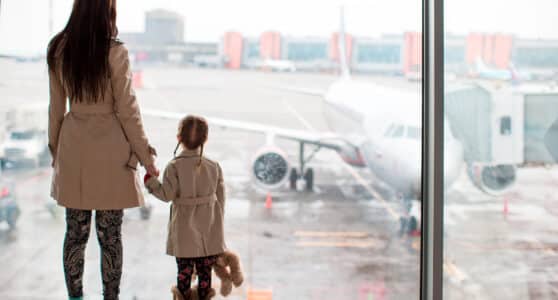Mother and child at the airport working through an international custody dispute.