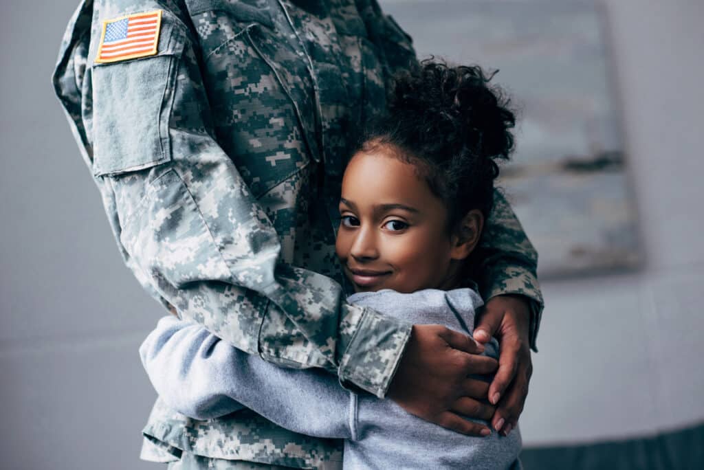 military family hugging
