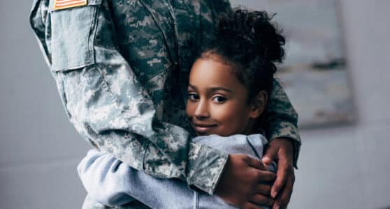 military family hugging